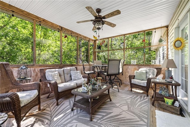 sunroom / solarium with ceiling fan and wooden ceiling