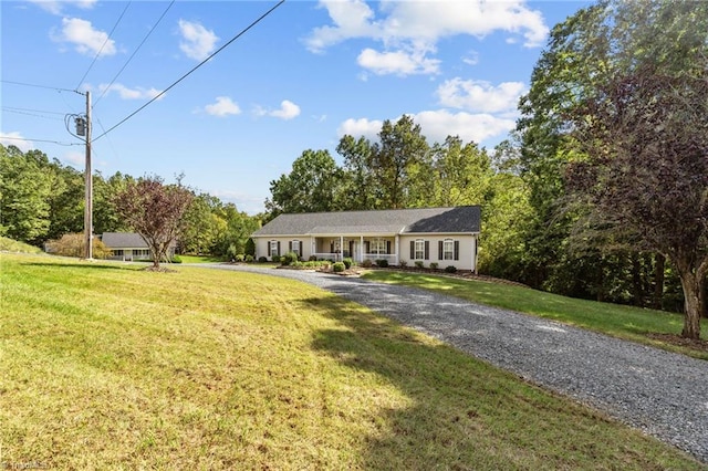 ranch-style home with a front yard