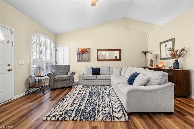 living room with vaulted ceiling and dark wood-type flooring