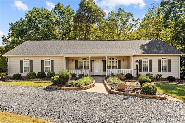 ranch-style home featuring covered porch