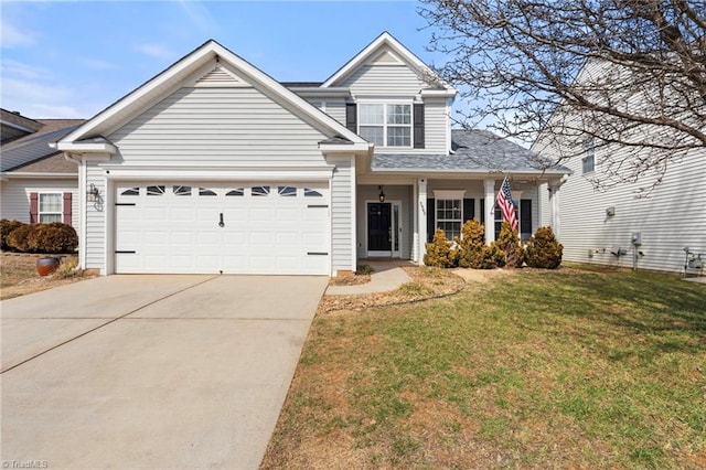 traditional-style house featuring an attached garage, driveway, and a front yard