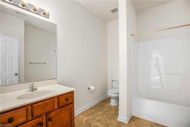 bathroom featuring baseboards, visible vents, toilet, and vanity
