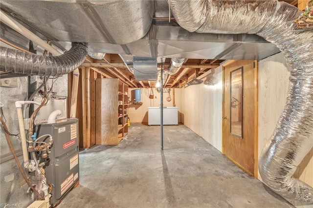 unfinished basement featuring washer and clothes dryer