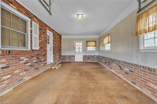 interior space with brick wall and visible vents