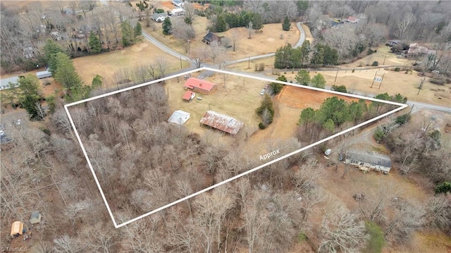 birds eye view of property featuring a rural view