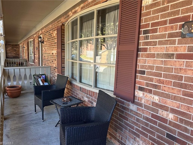 view of patio featuring a porch