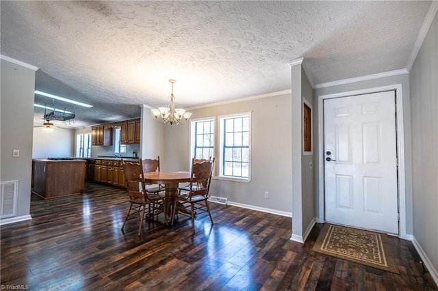 dining area with dark wood finished floors, crown molding, ceiling fan with notable chandelier, and baseboards