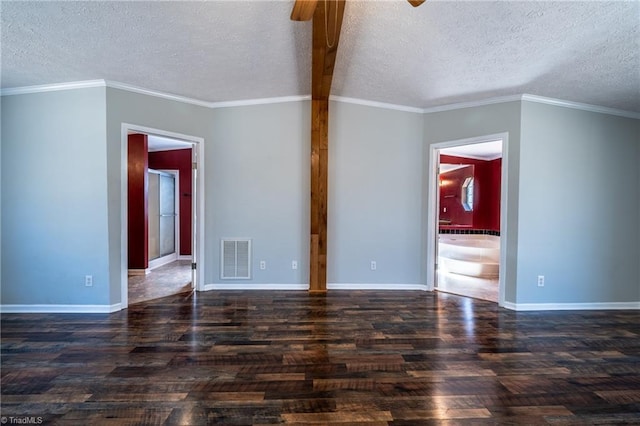 spare room with visible vents, crown molding, baseboards, and wood finished floors