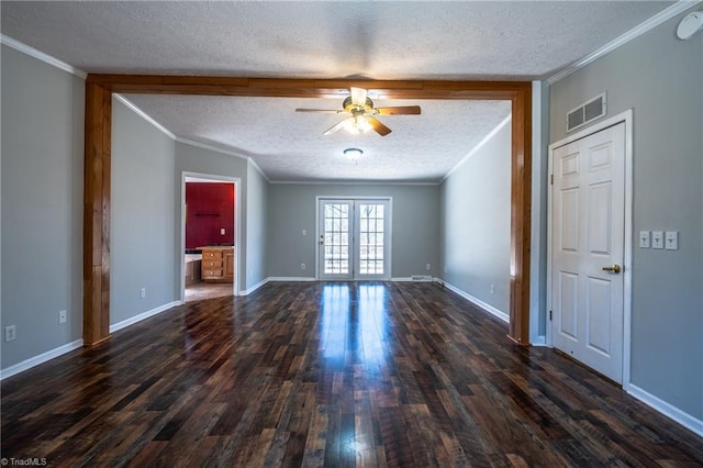 unfurnished room featuring visible vents, a textured ceiling, french doors, crown molding, and dark wood-style flooring