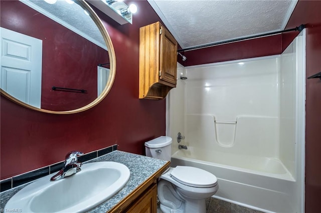 full bathroom with vanity,  shower combination, toilet, and a textured ceiling