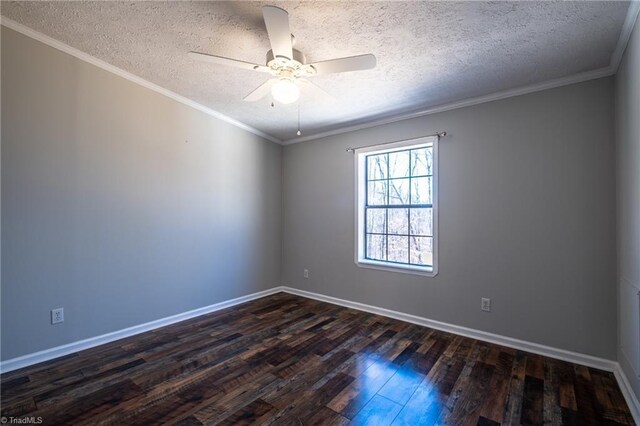 unfurnished room featuring baseboards, dark wood-style floors, a ceiling fan, and ornamental molding