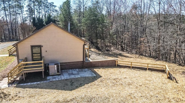 exterior space featuring central air condition unit and fence