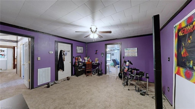 carpeted office featuring ceiling fan