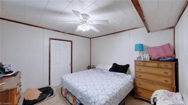 bedroom with carpet floors, ornamental molding, and ceiling fan