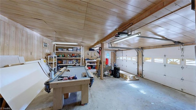 garage with a garage door opener, wooden walls, and wood ceiling