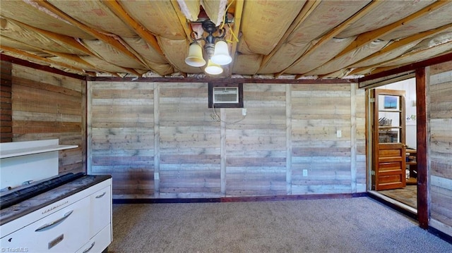 basement with dark carpet and a wall unit AC