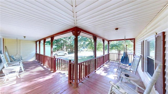 sunroom with wooden ceiling and a wealth of natural light