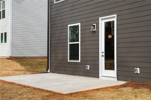 property entrance with a patio area