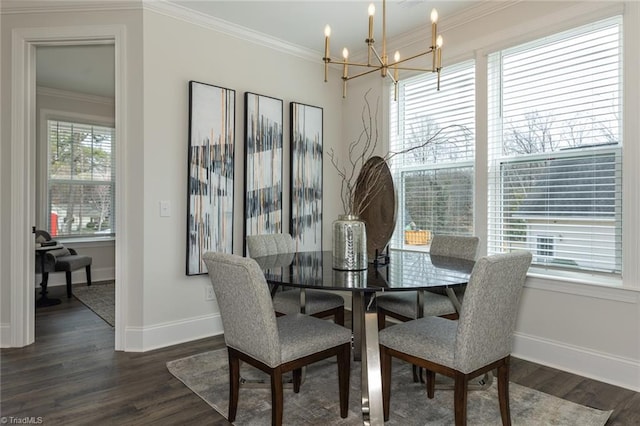 dining room featuring baseboards, dark wood-type flooring, a notable chandelier, and crown molding