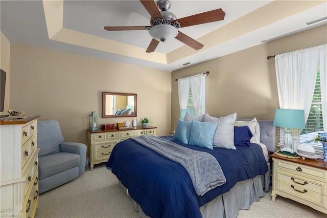 137 Bradford Place Ln, Lewisville, NC 27023 - bedroom featuring light carpet, multiple windows, and a raised ceiling