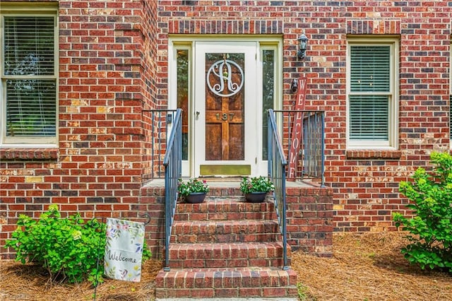 137 Bradford Place Ln, Lewisville, NC 27023 - view of exterior entry featuring brick siding