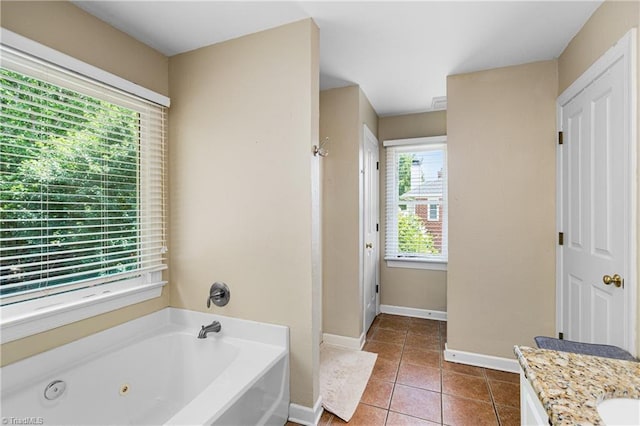 137 Bradford Place Ln, Lewisville, NC 27023 - bathroom with a jetted tub, vanity, and tile patterned flooring