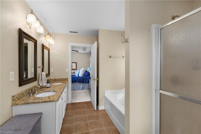 137 Bradford Place Ln, Lewisville, NC 27023 - bathroom featuring tile patterned flooring, double vanity, a garden tub, ensuite bath, and a stall shower