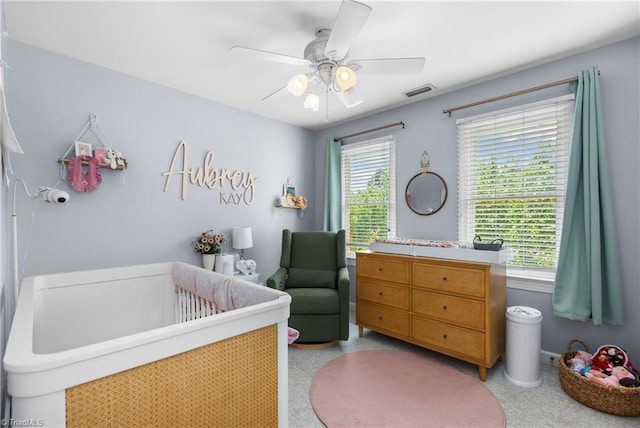 137 Bradford Place Ln, Lewisville, NC 27023 - bedroom with a crib and a ceiling fan