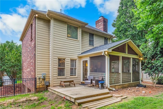 137 Bradford Place Ln, Lewisville, NC 27023 - back of house with a sunroom, a chimney, and a wooden deck