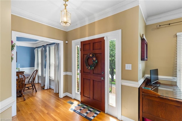 137 Bradford Place Ln, Lewisville, NC 27023 - foyer entrance with crown molding, light wood finished floors, and plenty of natural light