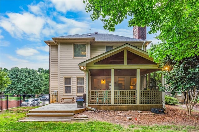 137 Bradford Place Ln, Lewisville, NC 27023 - back of property with a sunroom, a deck, and a chimney