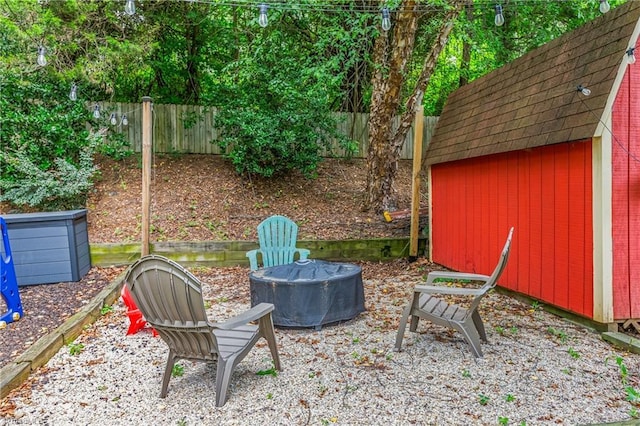137 Bradford Place Ln, Lewisville, NC 27023 - fenced backyard with a storage shed and a fire pit