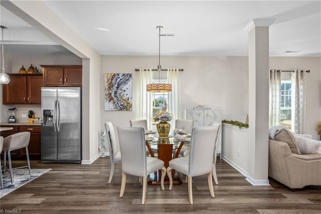 dining space featuring dark hardwood / wood-style floors