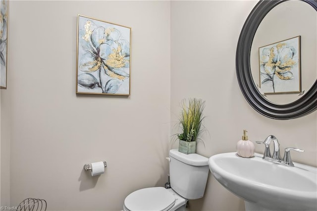 bathroom with toilet and sink