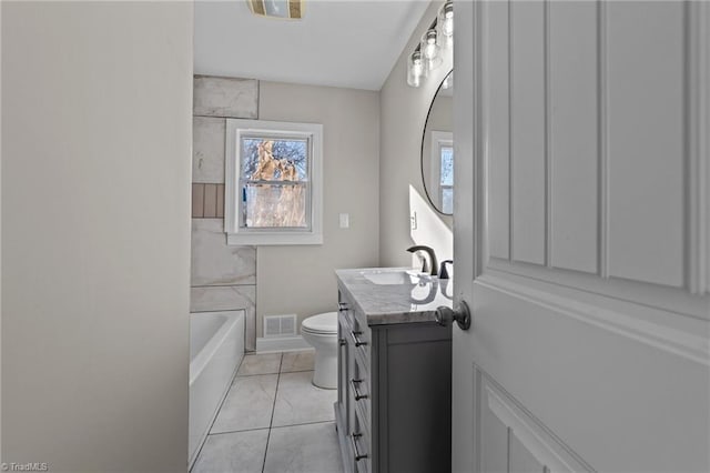 bathroom featuring toilet, tile patterned floors, and vanity