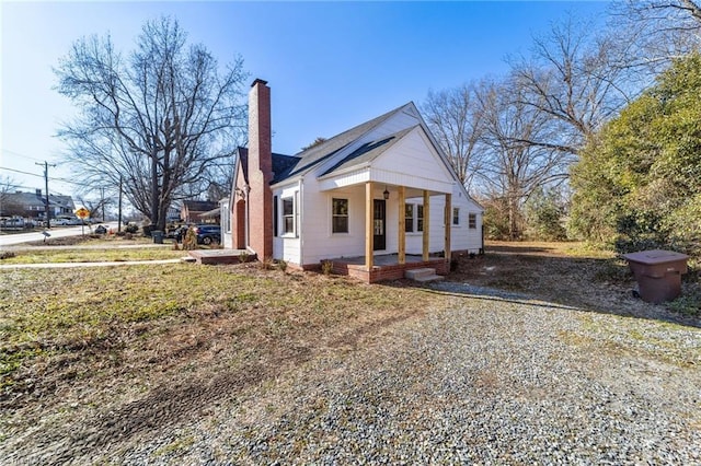 view of property exterior with a porch