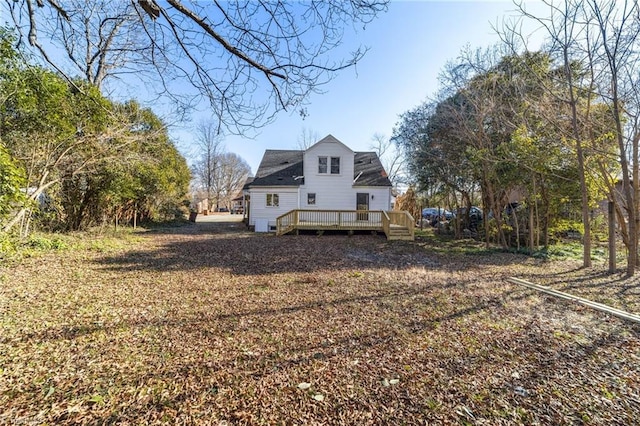 back of property featuring a deck