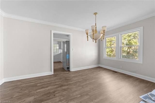 unfurnished dining area with a notable chandelier, dark wood-type flooring, and ornamental molding