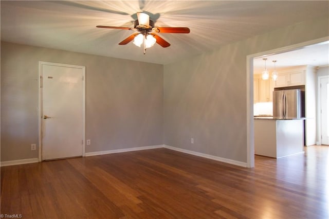 159 Evans Ln, Wilkesboro, NC 28697 - empty room with dark wood-type flooring, baseboards, and ceiling fan