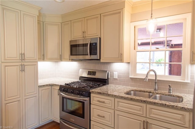 159 Evans Ln, Wilkesboro, NC 28697 - kitchen with a sink, cream cabinets, light stone counters, and stainless steel appliances