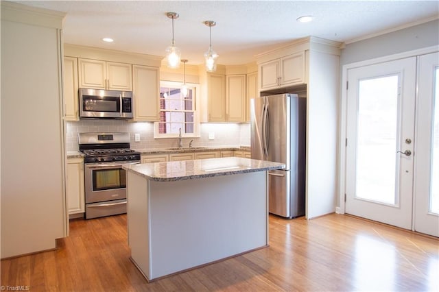 159 Evans Ln, Wilkesboro, NC 28697 - kitchen with backsplash, light stone countertops, light wood-style floors, stainless steel appliances, and a sink