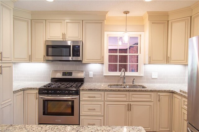 159 Evans Ln, Wilkesboro, NC 28697 - kitchen with a sink, tasteful backsplash, cream cabinets, and stainless steel appliances