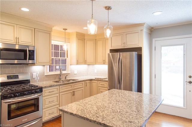 159 Evans Ln, Wilkesboro, NC 28697 - kitchen with a sink, cream cabinetry, light wood-type flooring, and stainless steel appliances