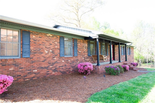 159 Evans Ln, Wilkesboro, NC 28697 - view of home's exterior with a porch and brick siding