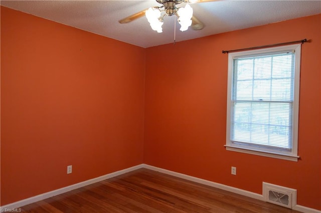 159 Evans Ln, Wilkesboro, NC 28697 - empty room with wood finished floors, ceiling fan, baseboards, and visible vents