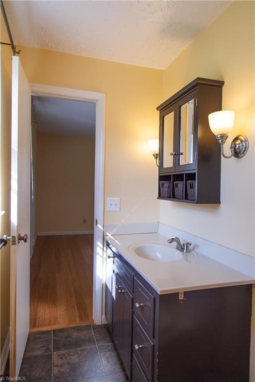 159 Evans Ln, Wilkesboro, NC 28697 - bathroom with vanity and baseboards