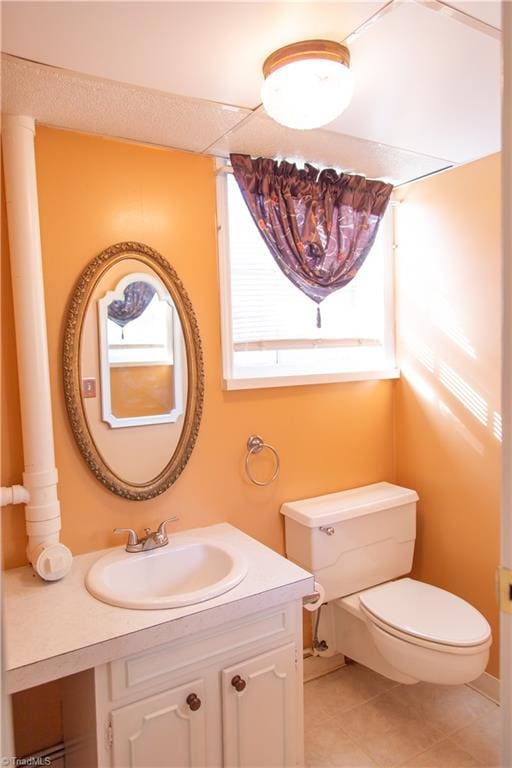159 Evans Ln, Wilkesboro, NC 28697 - bathroom featuring tile patterned floors, vanity, toilet, and a healthy amount of sunlight