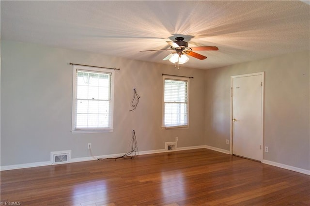 159 Evans Ln, Wilkesboro, NC 28697 - spare room with a healthy amount of sunlight, visible vents, a ceiling fan, and wood finished floors