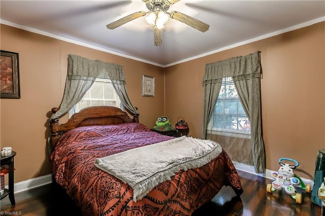 bedroom with ceiling fan, dark hardwood / wood-style flooring, and crown molding