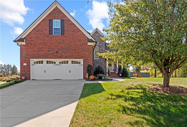 view of property featuring a garage and a front lawn